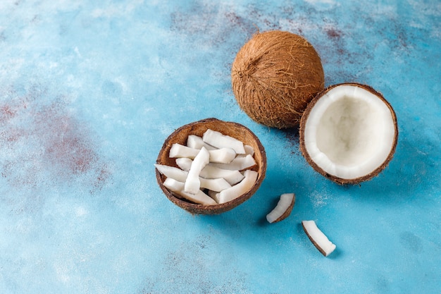 Whole coconut and various pieces of coconut