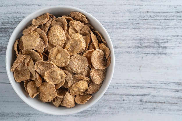 Whole grain glazed flakes in plate Healthy breakfast whole grain muesli in a bowl