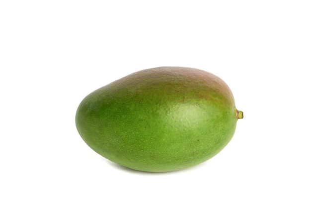 Whole green ripe mango isolated on white background