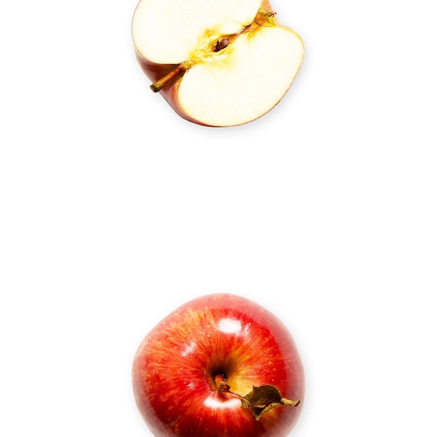 A whole and a half red apple on white background with copy space