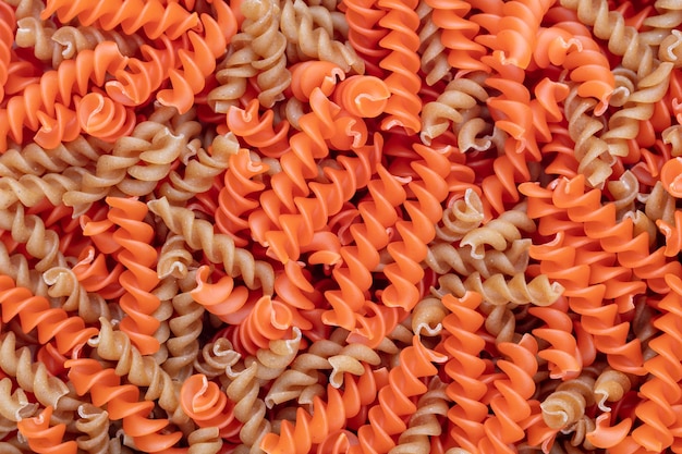 Whole lentils fusilli pasta background