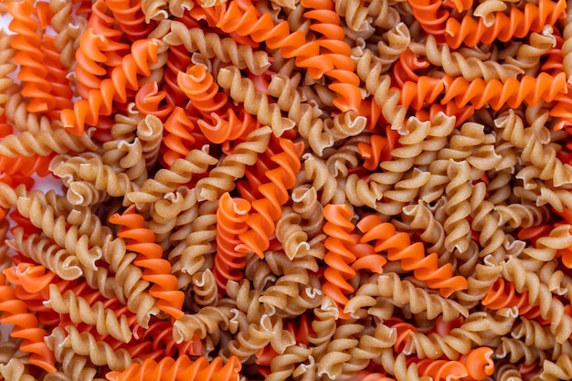 Whole lentils fusilli pasta background