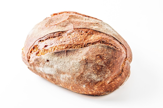 Whole loaf of rye bread isolated on white background