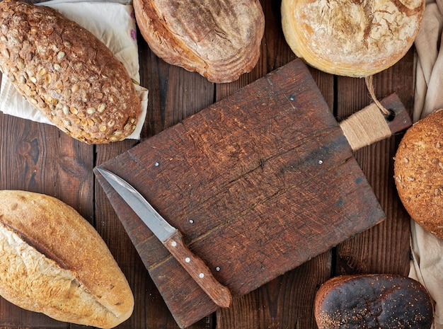 Whole loaves of bread made of white wheat flour and rye with seeds