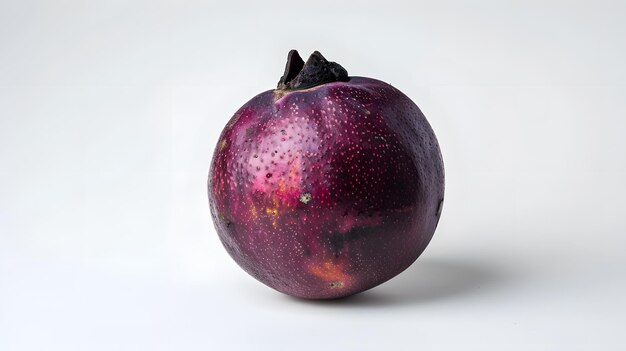 Photo whole mangosteen fruit with bright purple surface on light background