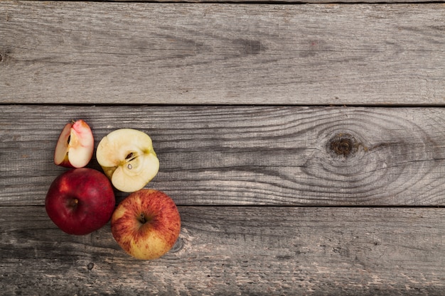 whole and sliced Apples on wood table