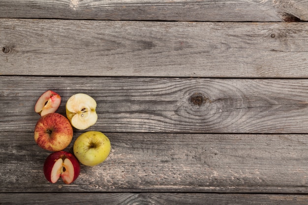 whole and sliced Apples on wood table