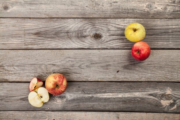 whole and sliced Apples on wood table