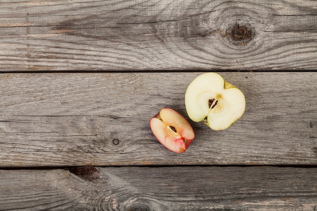 whole and sliced Apples on wood table