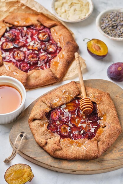 Whole wheat galette with plums, honey, lavender and almonds.