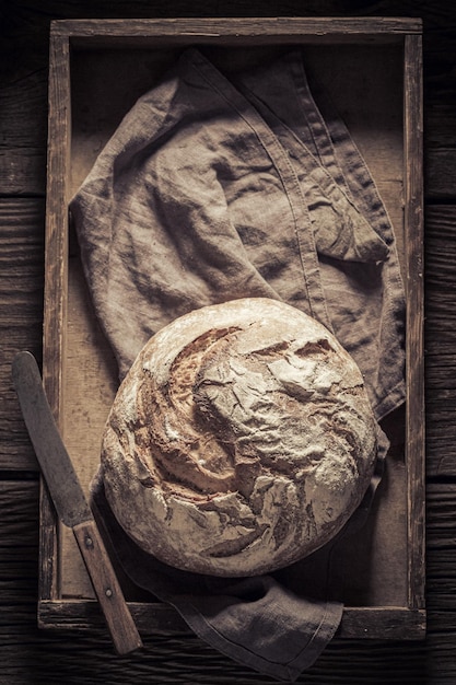 Wholegrain bread on linen cloth in wooden box