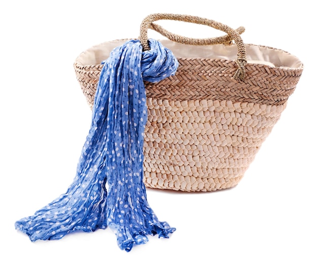 Wicker bag with colorful scarf isolated on white