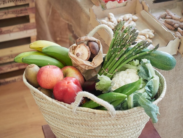 Wicker basket full of vegetables and fruits Sustainable food shopping concept plasticfree grocery store Small local business