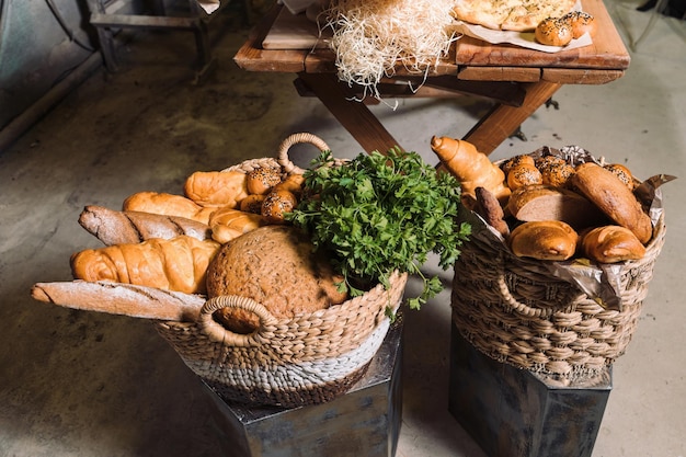 Wicker baskets with bread and greens Stand in the loft room