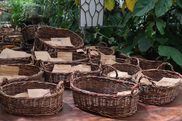 Wicker baskets with kraft bags with seeds in greenhouse Storage concept