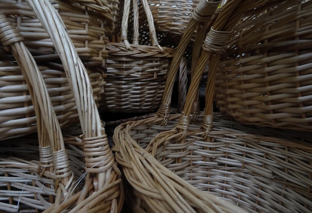 Wicker craft. Woven reed baskets with handles closeup stock photo