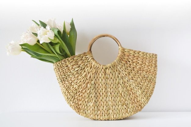 Wicker handbag with tulip flowers