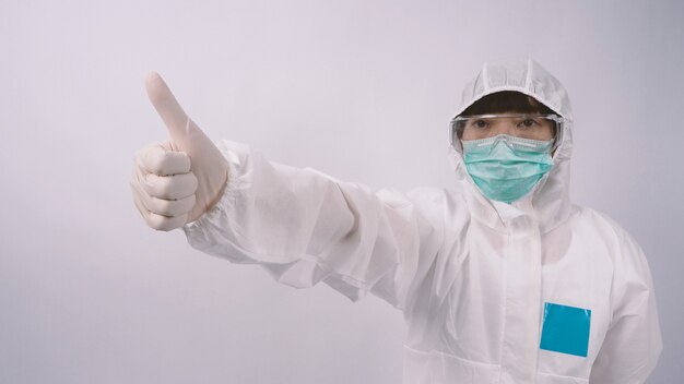 Wide angle images of Asian woman doctor in PPE suit or personal protection equipment and medical