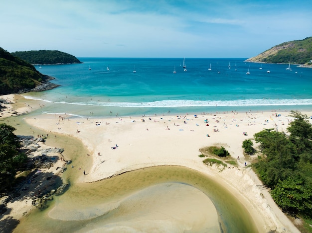 Wide angle view Nai Harn beach at phuket island on January 262023 Beautiful beach in thailand Amazing High angle view sea in phuket Island with blue sky cloudy background Travel holiday Concept