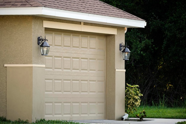 Wide garage double door and concrete driveway of new modern american house