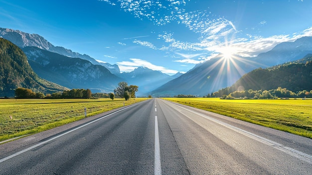 A wide road with grasslands and distant mountains on both side