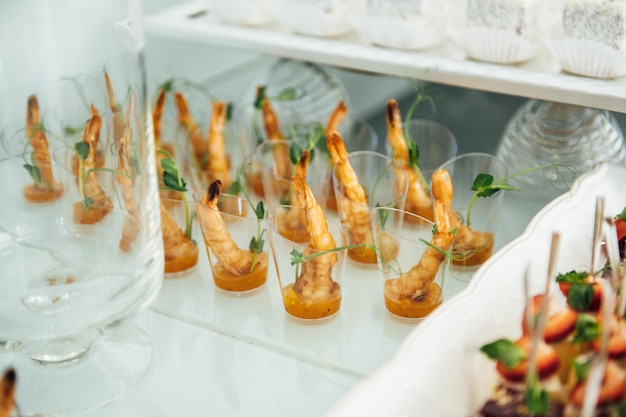 A wide variety of snacks on the table for guests Shrimp boiled pork various types of meat and other products