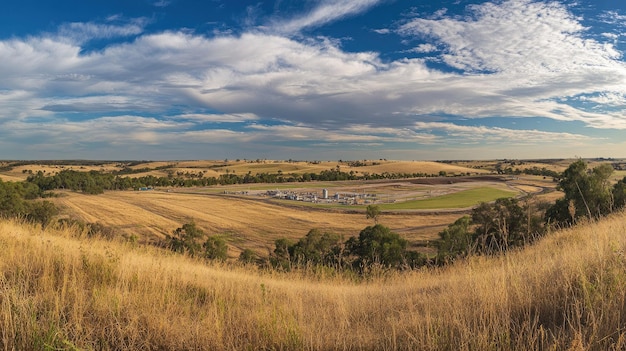 A wideangle view of a gas extraction site in a rural landscape plenty of copy space