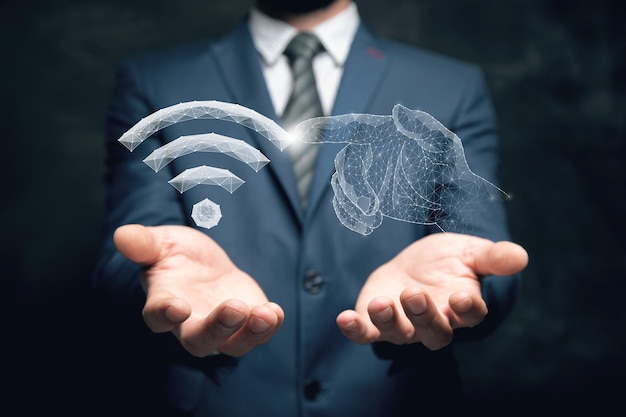 WiFi and hands from the network Man holding in his hand