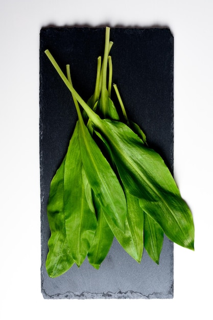 Wild garlic Wild garlic on a black board on a table