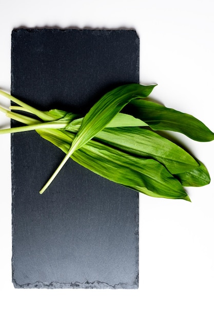 Wild garlic Wild garlic on a black board on a table