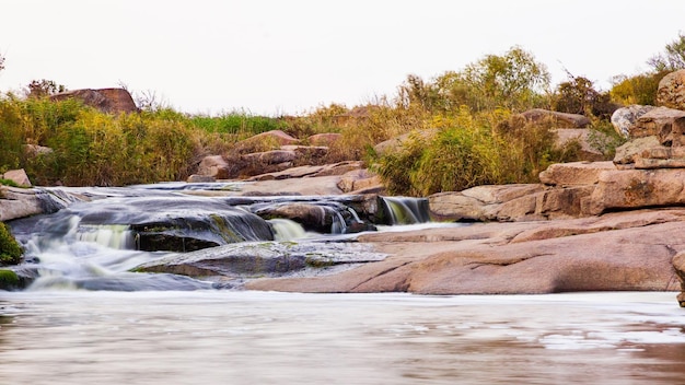 Wild Mountain River Flowing with Stone Boulders and Stone Rapids Rapid Splashing water in Creek Mountain stream in the autumn Abundant Clear Stream Tokiv canyon Ukraine