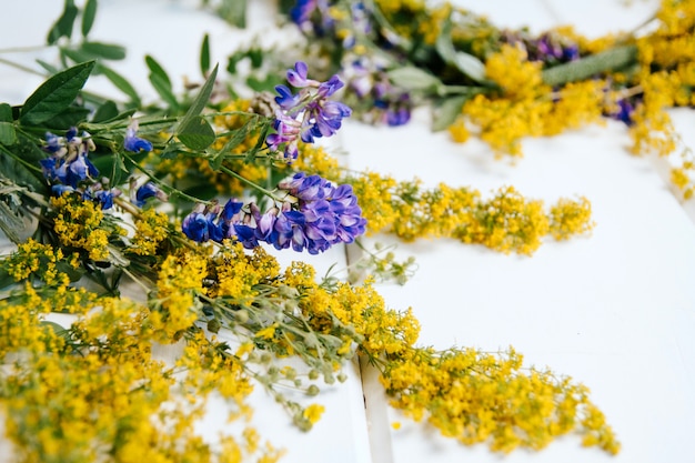 wildflowers and herbs on woode