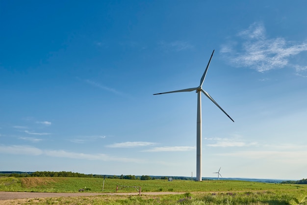 Wind turbine in the field. Wind power energy concept. Renewable energy for climate protection