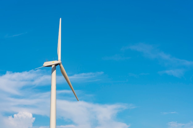 The wind turbine power working, blue sky, energy power concept