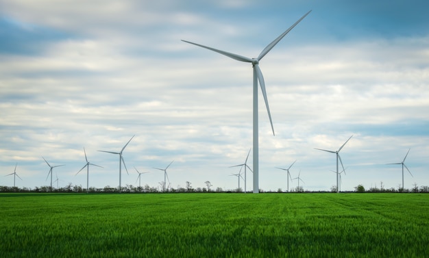 Wind turbines generating electricity with blue sky - energy conservation concept