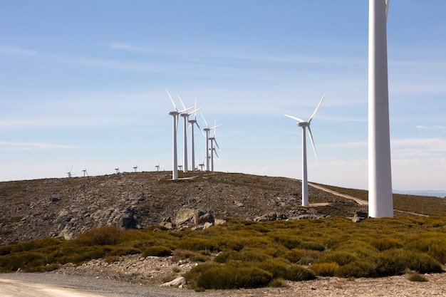 Wind turbines on a mountainous divide producing electricity by the force of the wind