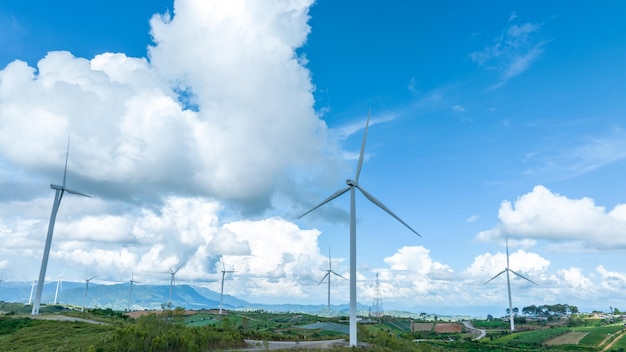 Wind Turbines Windmill Energy Farm Windmill on blue sky puffy clouds