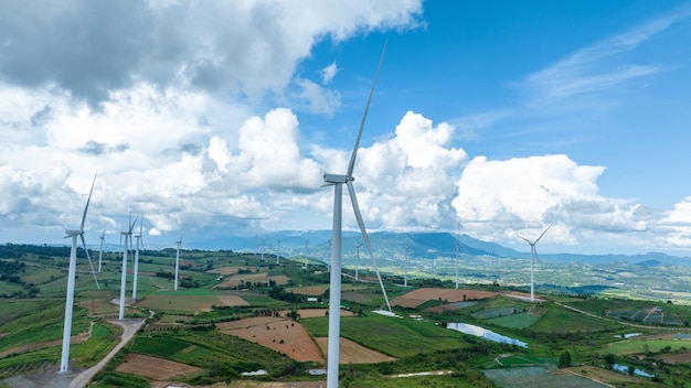 Wind Turbines Windmill Energy Farm Windmill on blue sky puffy clouds