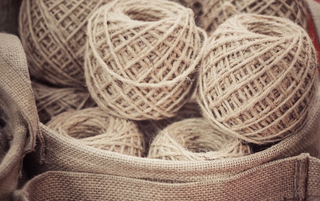 Winding the hand ball of string in basket