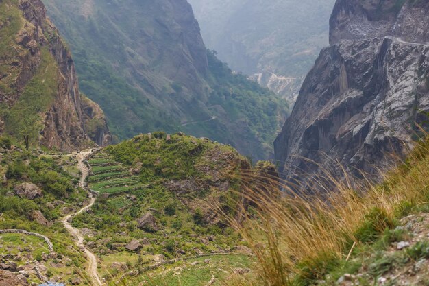 Winding path among the mountain slopes in the Himalayas