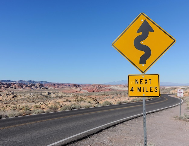 Winding road sign on a scenic desert road in Valley of Fire State Park