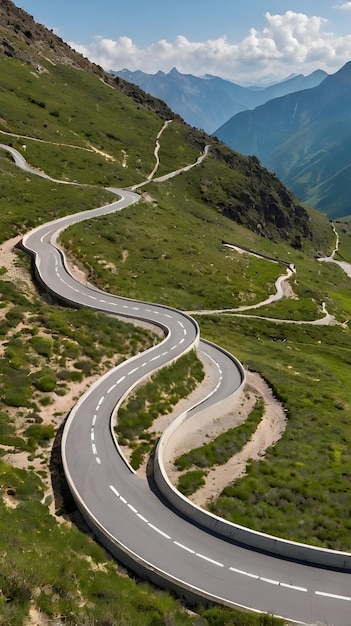 a winding road with a mountain in the background