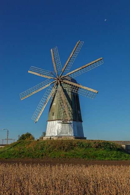 windmill dutch type against blue sky close up