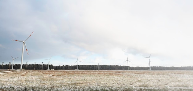 Windmill farm or wind park with high wind turbines for generation electricity