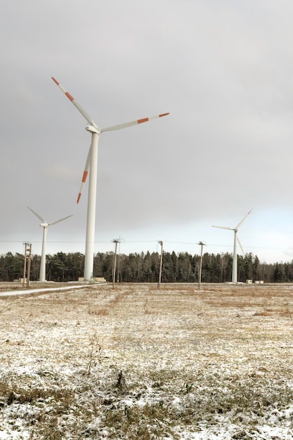 Windmill farm or wind park with high wind turbines for generation electricity