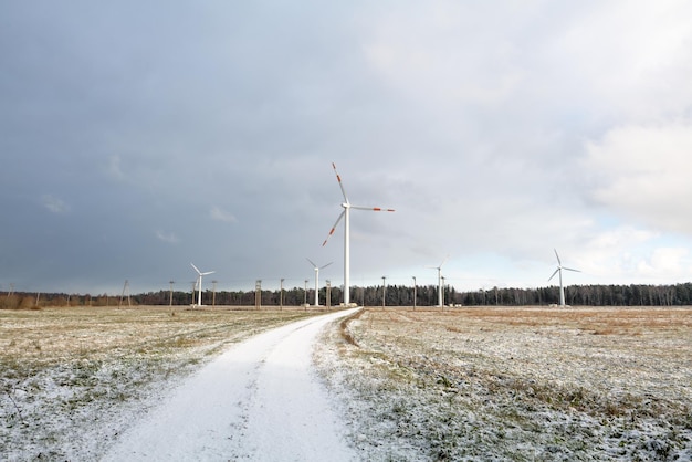 Windmill farm or wind park with high wind turbines for generation electricity