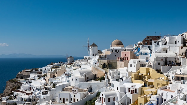 Windmill in Oia village of Santorini island , Greece