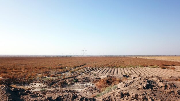 Windmills near the field top view from a drone