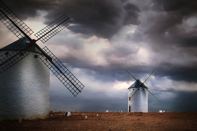 Windmills at sunset in castilla landscape photo