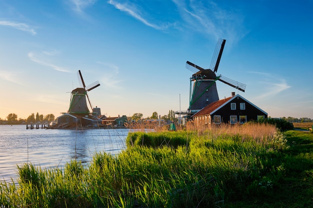 Windmills at Zaanse Schans in Holland on sunset. Zaandam, Netherlands